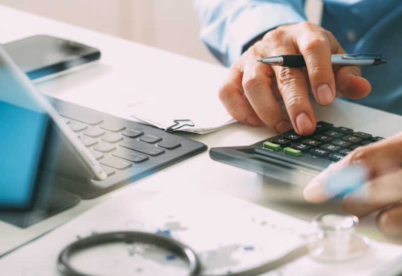 Traveler calculating travel insurance costs
