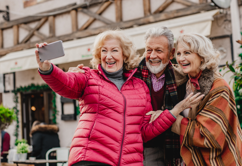 Group of senior travelers taking a selfie